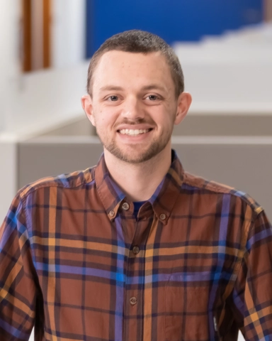 portrait of a smiling person in professional attire